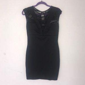 Black dress with deep V mesh cutout